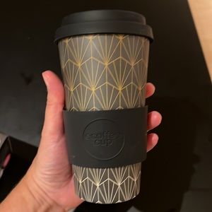 Drink cup with holder and lid for hot or cold drinks on the go.